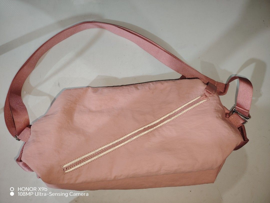 Lululemon Pink Crossbody Bag (Category: Cross-body Bags) located in Manila. Submitted by solenjella65945 (Listing ID 1471113258, Image 1). Description: - Authentic Lululemon shoulder bag in a cute pink shade - Clean condition with no major flaws - Stylish front diagonal zipper pocket - Matching pink strap with adjustable silver hardware buckle - Pink interior lining featuring a mesh slip pocket and Lululemon logo patch.