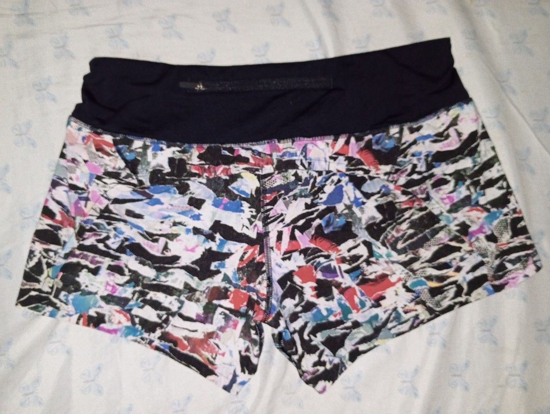 Lululemon Speed Up Shorts Multi Print Size 6 (Category: Shorts) located in Manila. Submitted by brugodoy (Listing ID 1471075552, Image 2). Description: - Brand: Lululemon - Style: Athletic running shorts with vibrant abstract multi-color print - Waistband: Solid black high-rise waistband for comfortable support - Features: Built-in liner and secure back zip pocket with signature logo zipper pull - Visibility: Reflective logo detail on the side le