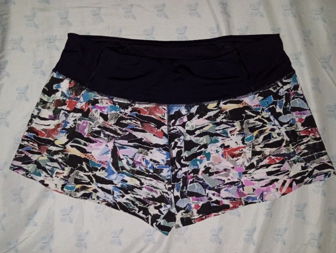 Lululemon Speed Up Shorts Multi Print Size 6 (Category: Shorts) located in Manila. Submitted by brugodoy (Listing ID 1471075552, Image 1). Description: - Brand: Lululemon - Style: Athletic running shorts with vibrant abstract multi-color print - Waistband: Solid black high-rise waistband for comfortable support - Features: Built-in liner and secure back zip pocket with signature logo zipper pull - Visibility: Reflective logo detail on the side le