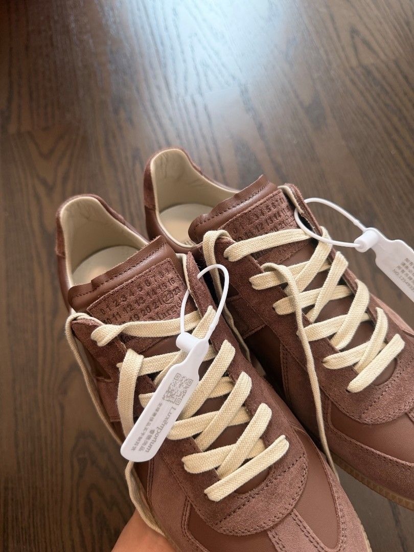 Maison Margiela gats(Light brown) (Category: Sneakers & Footwear) located in Makati City. Submitted by donda.archives (Listing ID 1471000566, Image 3). Description: Size 40-47. Batch with fully built-in NFC chip. It has a finer, smoother grain with a slightly more noticeable sheen. The entire upper uses premium top-layer cow suede with a high-sheen finish. Imported INCAS leather used. The leather has a nice matte finish, and the overall shoe shap