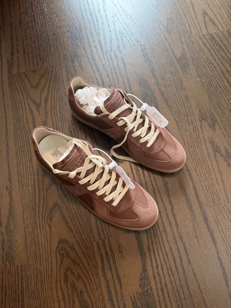 Maison Margiela gats(Light brown) (Category: Sneakers & Footwear) located in Makati City. Submitted by donda.archives (Listing ID 1471000566, Image 2). Description: Size 40-47. Batch with fully built-in NFC chip. It has a finer, smoother grain with a slightly more noticeable sheen. The entire upper uses premium top-layer cow suede with a high-sheen finish. Imported INCAS leather used. The leather has a nice matte finish, and the overall shoe shap