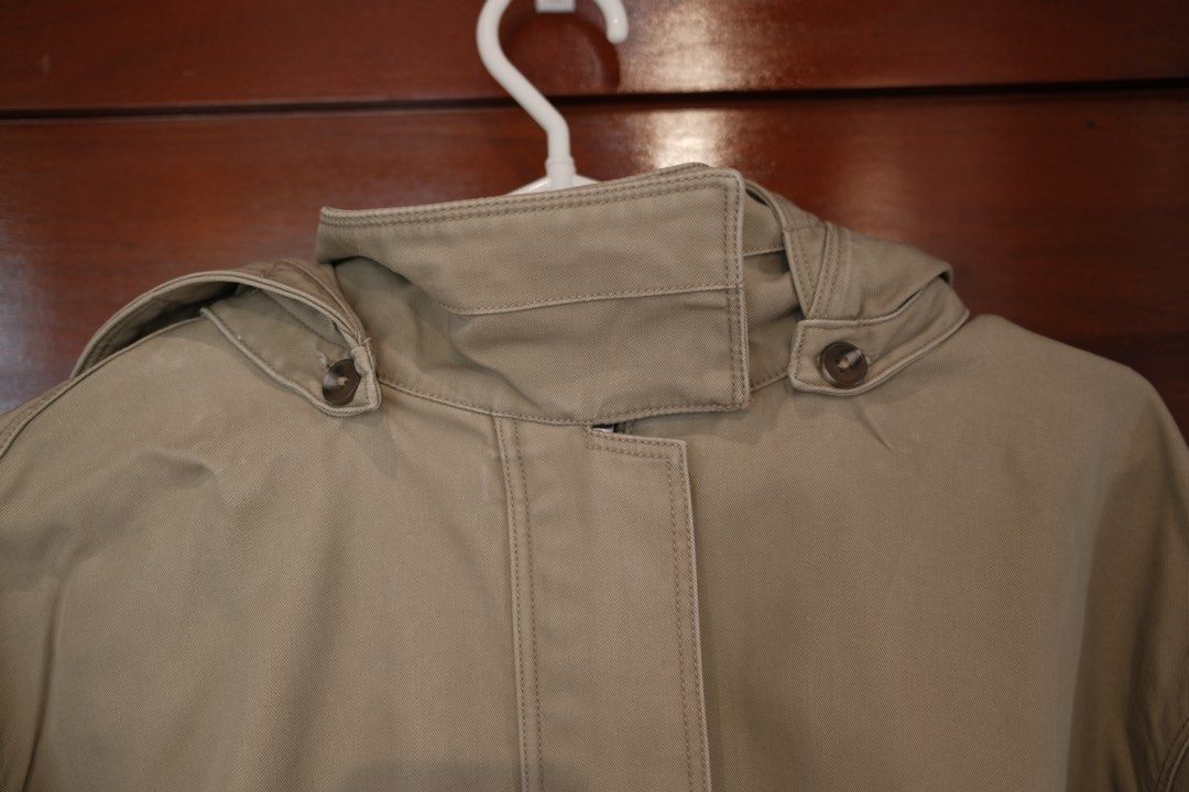 Mango Beige Hooded Jacket With Ruffled Hem (Category: Coats, Jackets and Outerwear) located in Makati City. Submitted by nomoreclutterph (Listing ID 1471048184, Image 2). Description: - Color: Versatile beige / neutral earth tone - Closure: Full front zipper with a button placket - Collar & Hood: High neckline with button closure and a removable hood (snap-on) - Fit & Style: Long sleeves with wide cuffs and a stylish ruffled hem with an adjustabl