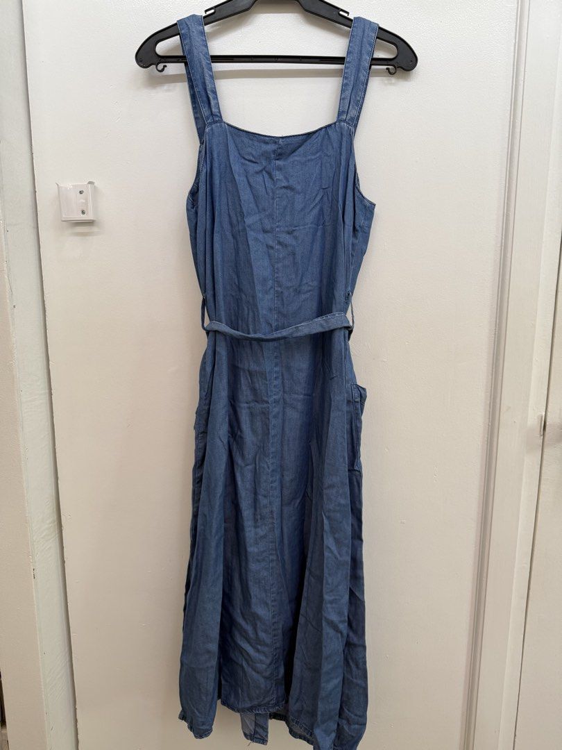 Mango Denim Midi Dress Size S/M (Category: Dresses) located in Quezon City. Submitted by reivia.vend (Listing ID 1471018357, Image 3). Description: - Brand: Mango - Size: EUR M / USA S / MEX M - Color: Mid blue wash - Style: Sleeveless, square neckline, front button placket with tortoiseshell buttons - Details: Includes matching self-tie fabric belt and two large front patch pockets - Material: Lightweight denim - Condition: Great casual piece fo