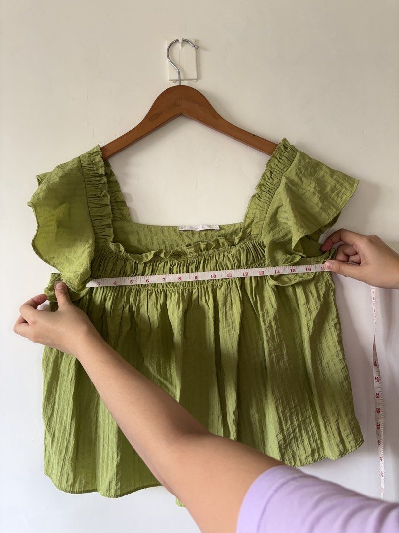 Mango Green Square Neck Ruffle Sleeve Blouse (Category: Blouses) located in Muntinlupa City. Submitted by shopkidsandmom.ph (Listing ID 1471035603, Image 2). Description: Mango green square neck blouse. Short ruffle sleeves, smocked bodice with stretchy elastic texture. Light and flowy material, easy to pull on. Length measures about 20 inches from shoulder to hem. Pit to pit width measures roughly 17 inches across. Great casual top for warm weat