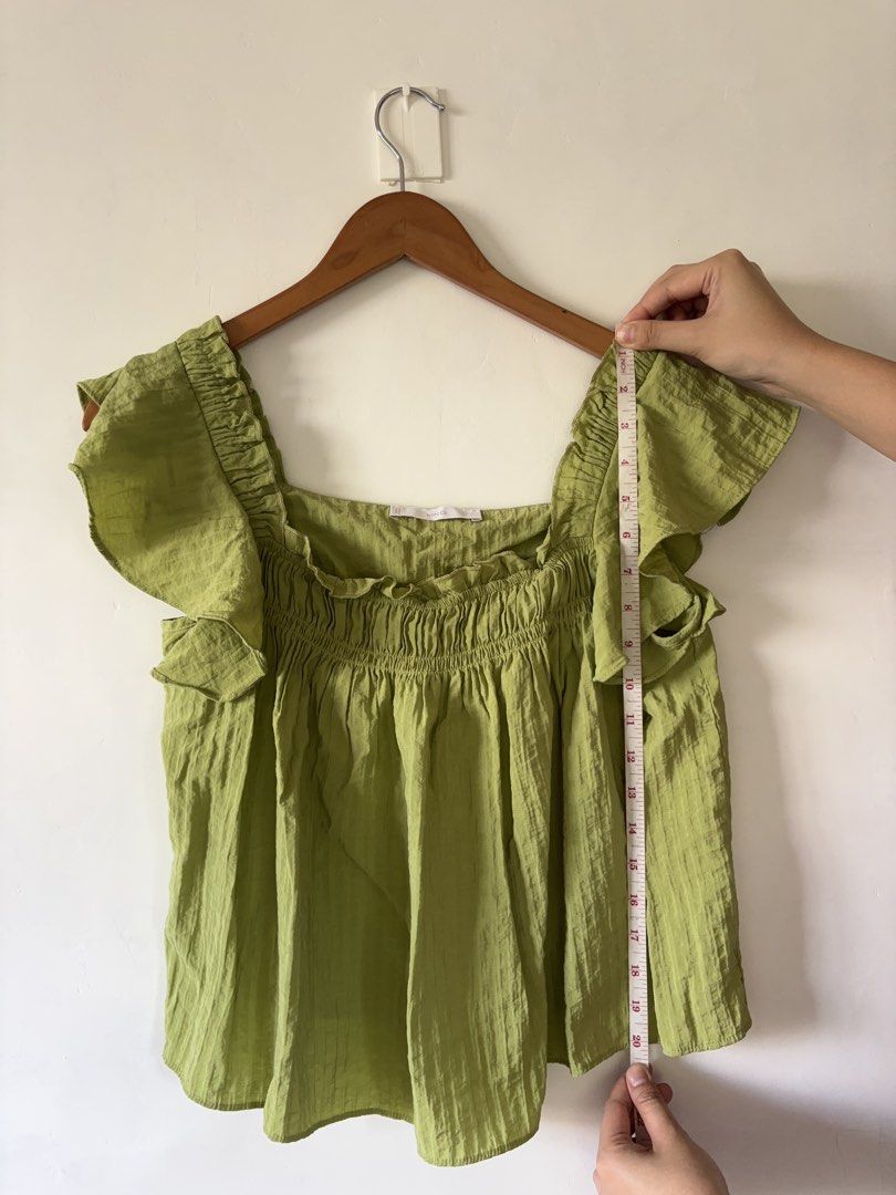 Mango Green Square Neck Ruffle Sleeve Blouse (Category: Blouses) located in Muntinlupa City. Submitted by shopkidsandmom.ph (Listing ID 1471035603, Image 1). Description: Mango green square neck blouse. Short ruffle sleeves, smocked bodice with stretchy elastic texture. Light and flowy material, easy to pull on. Length measures about 20 inches from shoulder to hem. Pit to pit width measures roughly 17 inches across. Great casual top for warm weat