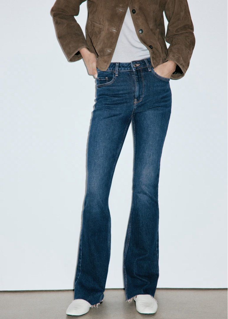 Mango Mid Waisted Flare Flared Jeans (Category: Jeans) located in Pasig City. Submitted by lihimzyou (Listing ID 1471022043, Image 2). Description: - Style: Mid-rise, flared leg denim jeans - Wash: Medium wash with subtle fading on front thighs - Details: Raw frayed hems, classic five-pocket styling, belt loops - Closure: Zip fly with button closure - Fit: Great fit, pairs perfectly with boots or sneakers.