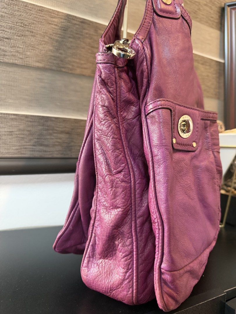 Marc by Marc Jacobs Purple Leather Shoulder Bag (Category: Luxury Bags & Wallets) located in Makati City. Submitted by bagattic_etc (Listing ID 1470940373, Image 2). Description: Brand: Marc by Marc Jacobs Material: Soft textured purple leather with silver-tone hardware Straps: Comfortable dual shoulder straps Pockets: Two exterior front pockets with secure push-lock closures Interior: Spacious zippered main compartment lined with stylish black a