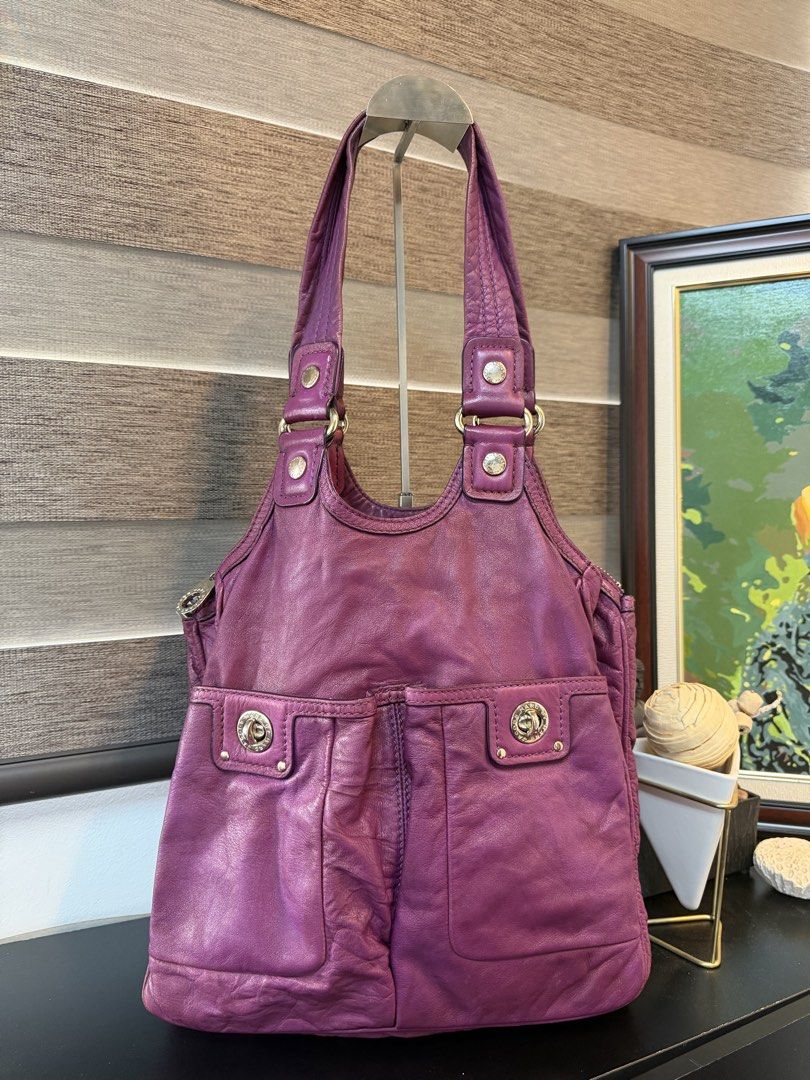Marc by Marc Jacobs Purple Leather Shoulder Bag (Category: Luxury Bags & Wallets) located in Makati City. Submitted by bagattic_etc (Listing ID 1470940373, Image 1). Description: Brand: Marc by Marc Jacobs Material: Soft textured purple leather with silver-tone hardware Straps: Comfortable dual shoulder straps Pockets: Two exterior front pockets with secure push-lock closures Interior: Spacious zippered main compartment lined with stylish black a