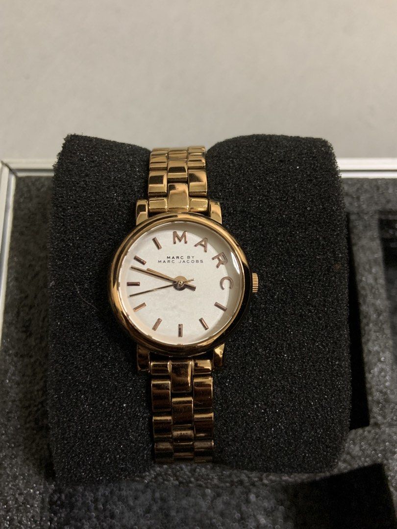 Marc by Marc Jacobs Rose Gold Watch (Category: Women's Watches) located in Manila. Submitted by relokado (Listing ID 1470938330, Image 1). Description: - Authentic Marc by Marc Jacobs rose gold watch - Clean white dial featuring rose gold hands and M-A-R-C letter hour markers - Secure link bracelet with clasp closure - Timeless, classic design perfect for everyday wear - Battery is working fine and ready to use.