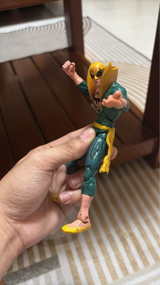 Marvel Legends Iron Fist Action Figure (Category: Figurines & Statues) located in Manila. Submitted by khoon01e (Listing ID 1470986798, Image 2). Description: - Green and yellow classic Marvel Iron Fist action figure - Features iconic dragon logo on chest and tall collar - Highly articulated limbs for dynamic martial arts and fighting poses - Stands firmly for easy display - Great collectible piece for comic fans and Defenders fans.