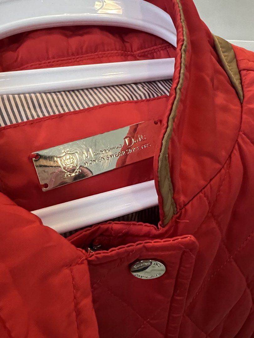 Massimo Dutti Red Quilted Jacket Size L (Category: Coats, Jackets and Outerwear) located in Calamba. Submitted by noreenmend83749 (Listing ID 1470962220, Image 3). Description: - Brand: Massimo Dutti - Color: Bright Red with Brown Trim - Size: EUR L / USA L / MEX 34 - Details: Gold brand lettering on the back, front snap buttons, lower patch pockets with snap closures - Lining: Stylish striped inner lining - Origin: Made in Vietnam Preloved :) no