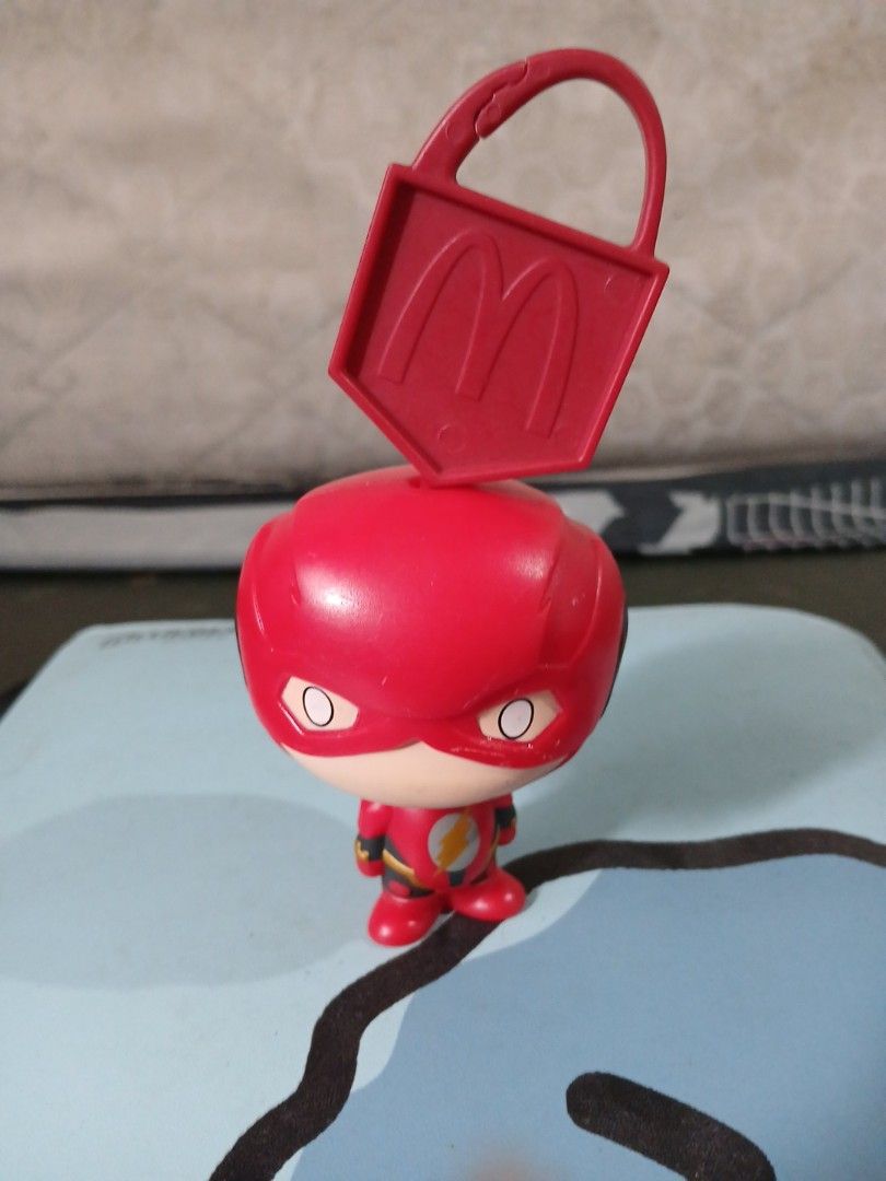 McDonalds DC The Flash Chibi Figurine Toy Keychain (Category: Character Goods) located in Manila. Submitted by diczenestr94951 (Listing ID 1470940479, Image 1). Description: - Official McDonald's promotional The Flash chibi toy - Features cute red suit, mask, and yellow lightning emblem - Attached red McDonald's branded plastic tag with golden arches logo - Compact size, great for clipping onto bags or backpacks - Perfect addition for DC Comics a