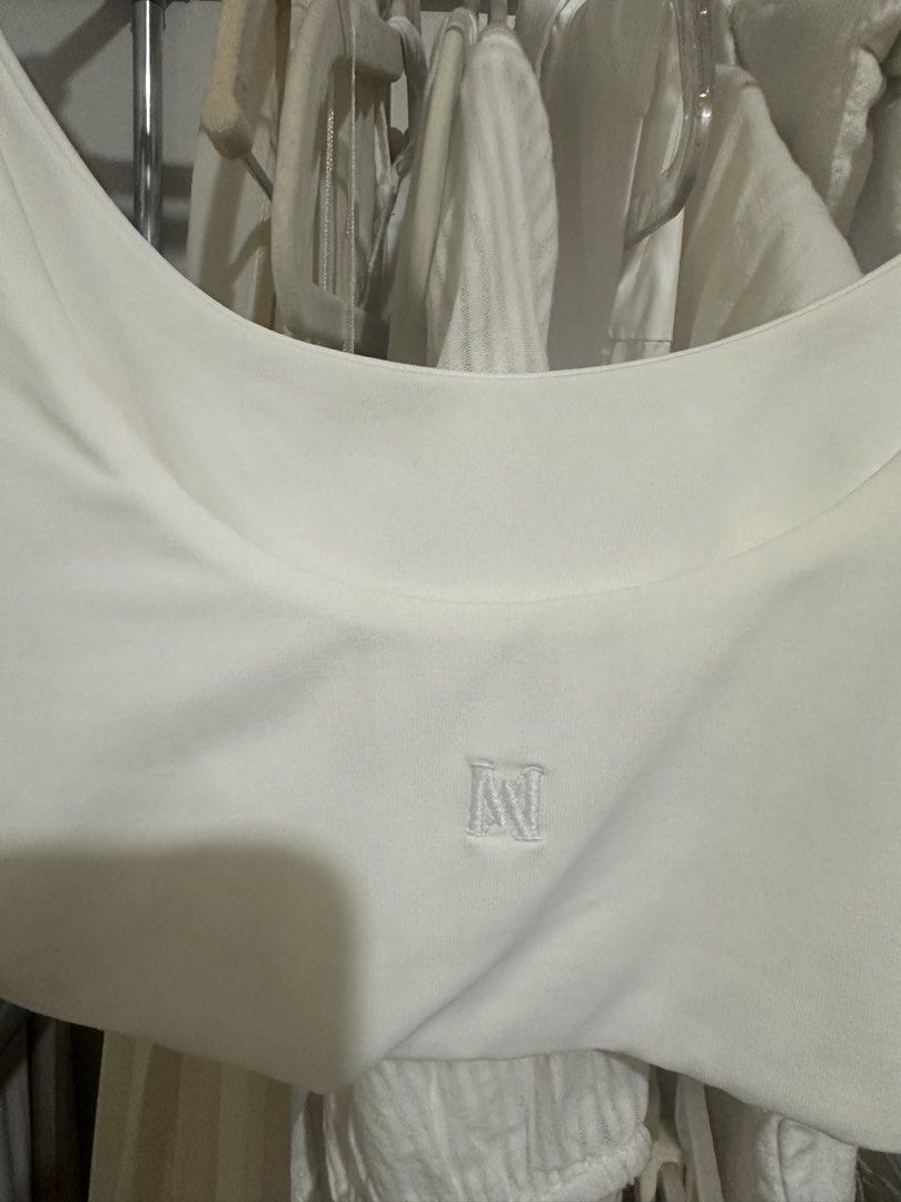 Meshki White Bralette (Category: Sleeveless) located in Davao. Submitted by krau_ (Listing ID 1470955654, Image 3). Description: Buttery soft With Meshki logo at the back Can be worn alone or for layering Issue: storage stains Small on tag.