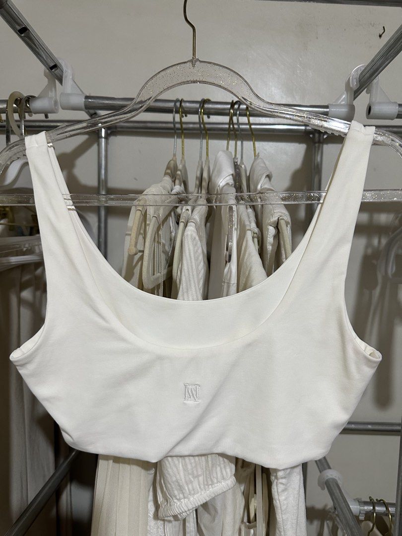 Meshki White Bralette (Category: Sleeveless) located in Davao. Submitted by krau_ (Listing ID 1470955654, Image 2). Description: Buttery soft With Meshki logo at the back Can be worn alone or for layering Issue: storage stains Small on tag.
