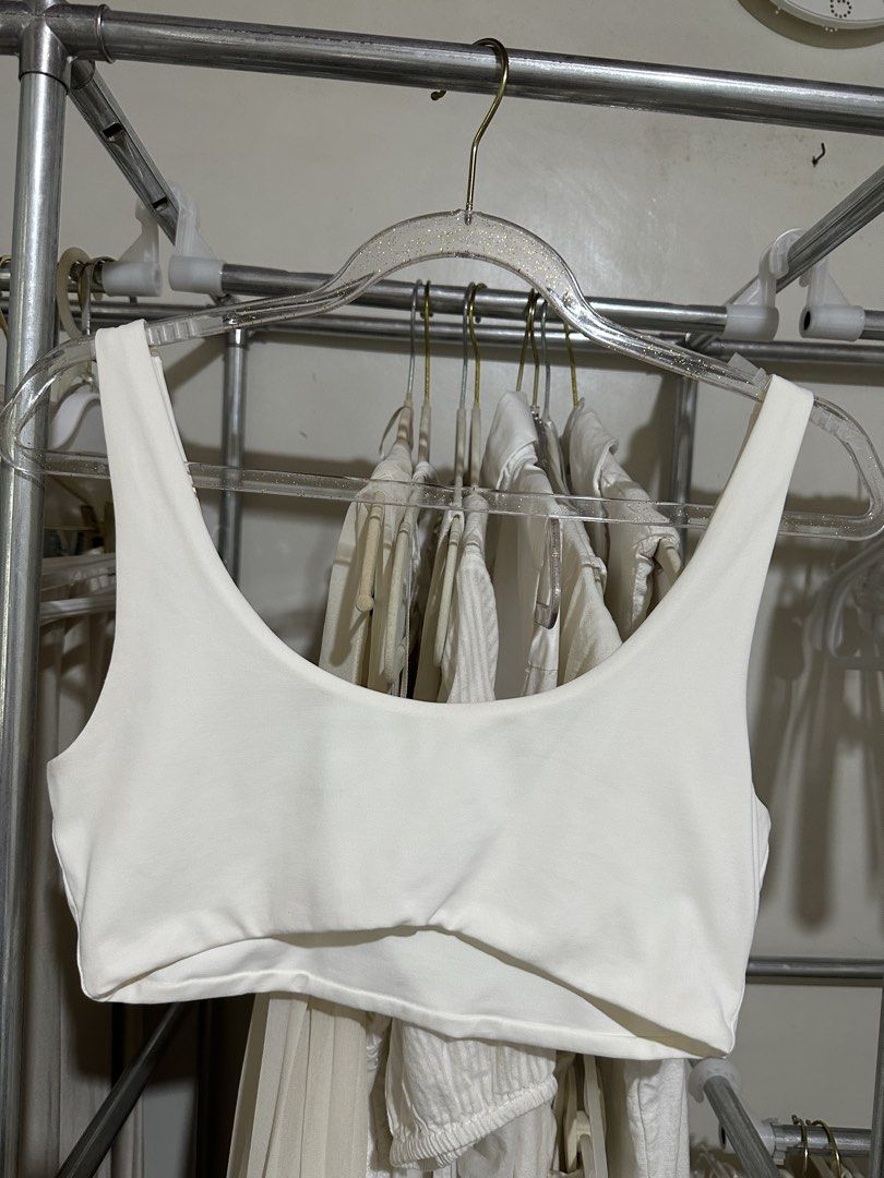Meshki White Bralette (Category: Sleeveless) located in Davao. Submitted by krau_ (Listing ID 1470955654, Image 1). Description: Buttery soft With Meshki logo at the back Can be worn alone or for layering Issue: storage stains Small on tag.