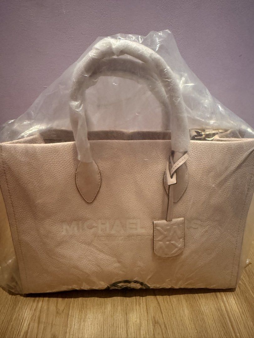 Michael Kors Mirella Pink Tote Bag (Category: Shoulder Bags) located in Pasig City. Submitted by sea321 (Listing ID 1470940293, Image 1). Description: - Authentic Michael Kors Mirella tote in Powder Blush Multi - Crafted from durable pebbled leather with elegant gold-tone hardware - Dual top handles and a convenient adjustable fabric shoulder strap - Spacious fabric-lined interior featuring a secure zip pocket and slip pockets - Includes matching