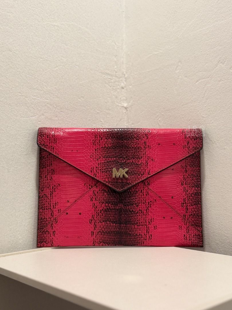 Michael Kors Pink Snakeskin Envelope Clutch Bag (Category: Luxury Bags & Wallets) located in Paranaque City. Submitted by juliasmomsy (Listing ID 1471058511, Image 1). Description: Selling my unused Authentic Michael Kors Bag! :) - SIZE: L: 25 cm, H: 18 cm, Handle drop: 46 cm - STYLE: Envelope clutch bag with chain strap (WOC) - COLOR/PATTERN: Vibrant pink snakeskin embossed - HARDWARE: Gold-tone MK logo. - INTERIOR: 6 card slots and a zippered c