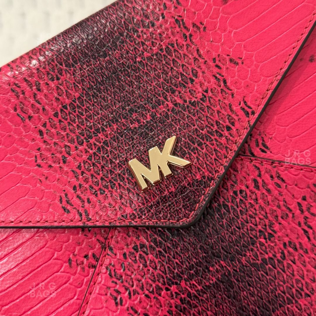 Michael Kors Pink Snakeskin Envelope Clutch Bag (Category: Luxury Bags & Wallets) located in Paranaque City. Submitted by juliasmomsy (Listing ID 1471058511, Image 3). Description: Selling my unused Authentic Michael Kors Bag! :) - SIZE: L: 25 cm, H: 18 cm, Handle drop: 46 cm - STYLE: Envelope clutch bag with chain strap (WOC) - COLOR/PATTERN: Vibrant pink snakeskin embossed - HARDWARE: Gold-tone MK logo. - INTERIOR: 6 card slots and a zippered c