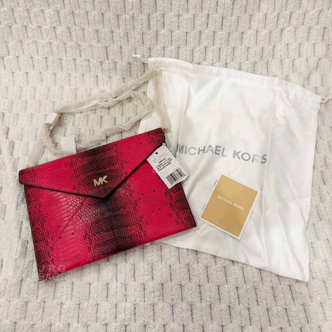 Michael Kors Pink Snakeskin Envelope Clutch Bag (Category: Luxury Bags & Wallets) located in Paranaque City. Submitted by juliasmomsy (Listing ID 1471058511, Image 2). Description: Selling my unused Authentic Michael Kors Bag! :) - SIZE: L: 25 cm, H: 18 cm, Handle drop: 46 cm - STYLE: Envelope clutch bag with chain strap (WOC) - COLOR/PATTERN: Vibrant pink snakeskin embossed - HARDWARE: Gold-tone MK logo. - INTERIOR: 6 card slots and a zippered c