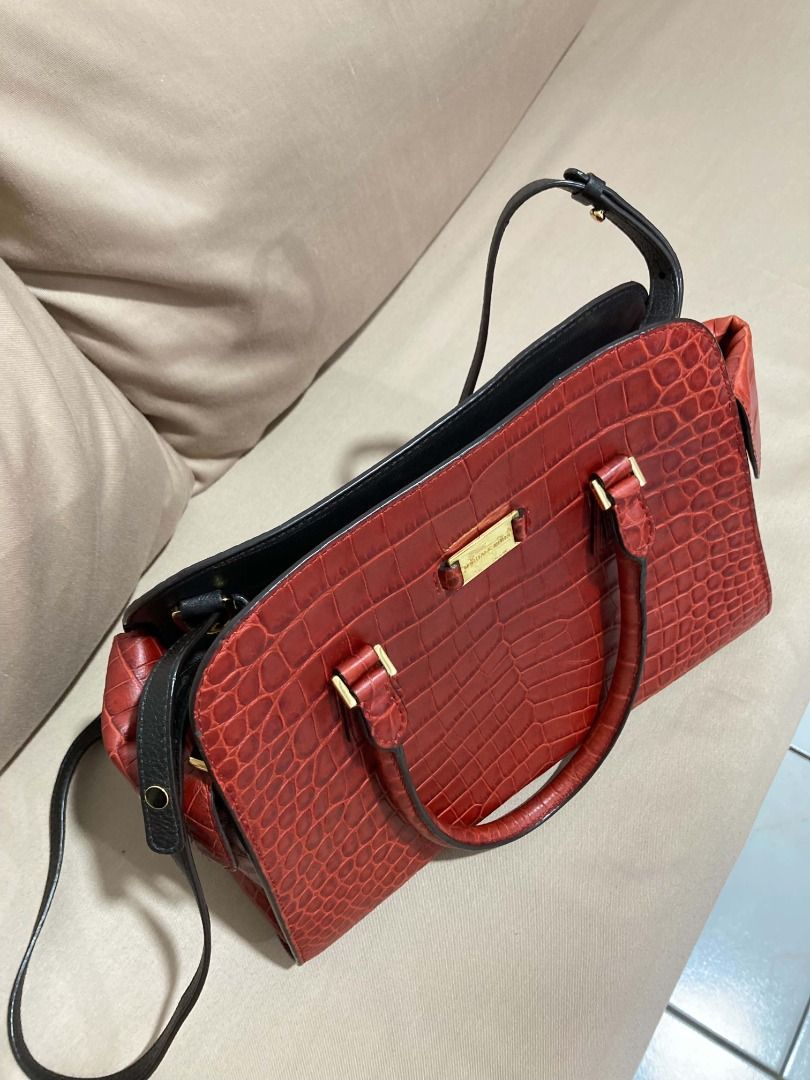 Michael Kors Red Crocodile Embossed Satchel Handbag (Category: Luxury Bags & Wallets) located in Manila. Submitted by faireeph (Listing ID 1471053274, Image 2). Description: - Brand: Michael Kors - Style: Structured handbag / Crossbody - Color: Rich Red with gold-tone hardware - Material: Premium crocodile embossed leather - Features: Dual top carry handles, detachable black crossbody strap, side pocket with clasp closure - Interior: Clean lining