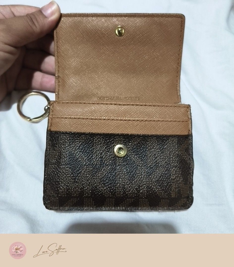 Michael Kors Small card wallet (Category: Wallets & Card holders) located in Cavite. Submitted by Love.Saffron (Listing ID 1471048259, Image 3). Description: Mivhael Kors Small card wallet Php 350 only (LAST PRICE POSTED) Preloved MK wallet Heavily used Please see photos Faded hardwares Missing rubber lining Location: DASMARIÑAS CAVITE.