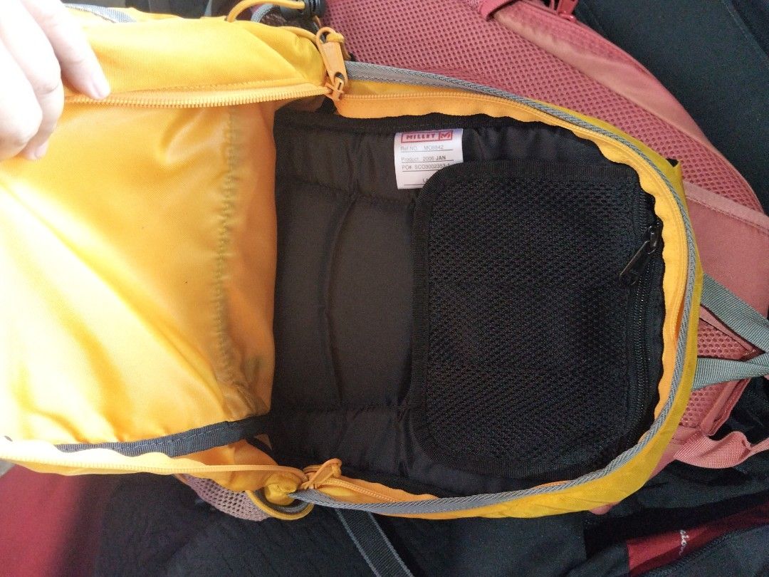Millet Yellow Hiking Backpack (Category: Hiking & Camping) located in Abucay. Submitted by cristineca20489 (Listing ID 1470955581, Image 3). Description: - Brand: Millet - Color: Bright yellow with stylish grey accents - Storage: Front zippered pocket, main compartment, and internal zip mesh pocket - Convenience: Dual mesh side pockets for water bottles or essentials - Comfort: Padded mesh back panel and fully adjustable shoulder straps - Perfect