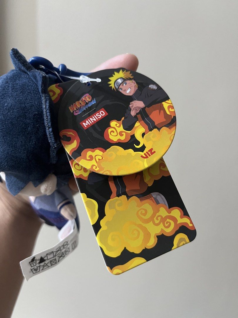 Miniso Naruto Shippuden Sasuke Plush Pendant Keychain (Category: Plushies & Soft Toys) located in Iloilo. Submitted by ggukiesells (Listing ID 1471037827, Image 3). Description: - Authentic Miniso x Naruto Shippuden merchandise - Character: Sasuke Uchiha plush pendant - Size: Approximately 11 cm (4 inches) long - Features: Soft polyester material with embroidered face details - Inclusion: Original tag still attached and blue plastic clip for easy