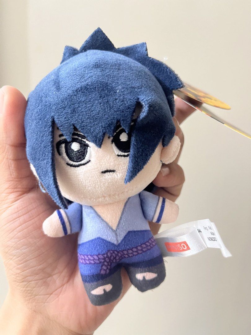Miniso Naruto Shippuden Sasuke Plush Pendant Keychain (Category: Plushies & Soft Toys) located in Iloilo. Submitted by ggukiesells (Listing ID 1471037827, Image 2). Description: - Authentic Miniso x Naruto Shippuden merchandise - Character: Sasuke Uchiha plush pendant - Size: Approximately 11 cm (4 inches) long - Features: Soft polyester material with embroidered face details - Inclusion: Original tag still attached and blue plastic clip for easy