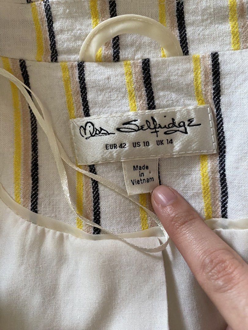 Miss Selfridge Striped Blazer Jacket Size UK 14 (Category: Coats, Jackets and Outerwear) located in Quezon City. Submitted by damclothings.ph (Listing ID 1470953272, Image 3). Description: - Brand: Miss Selfridge - Design: White with yellow, black, and beige vertical stripes - Size: EUR 42, US 10, UK 14 - Details: Fully lined in white, structured shoulders, front pocket flaps - Origin: Made in Vietnam - Style: Great layering piece for smart casua