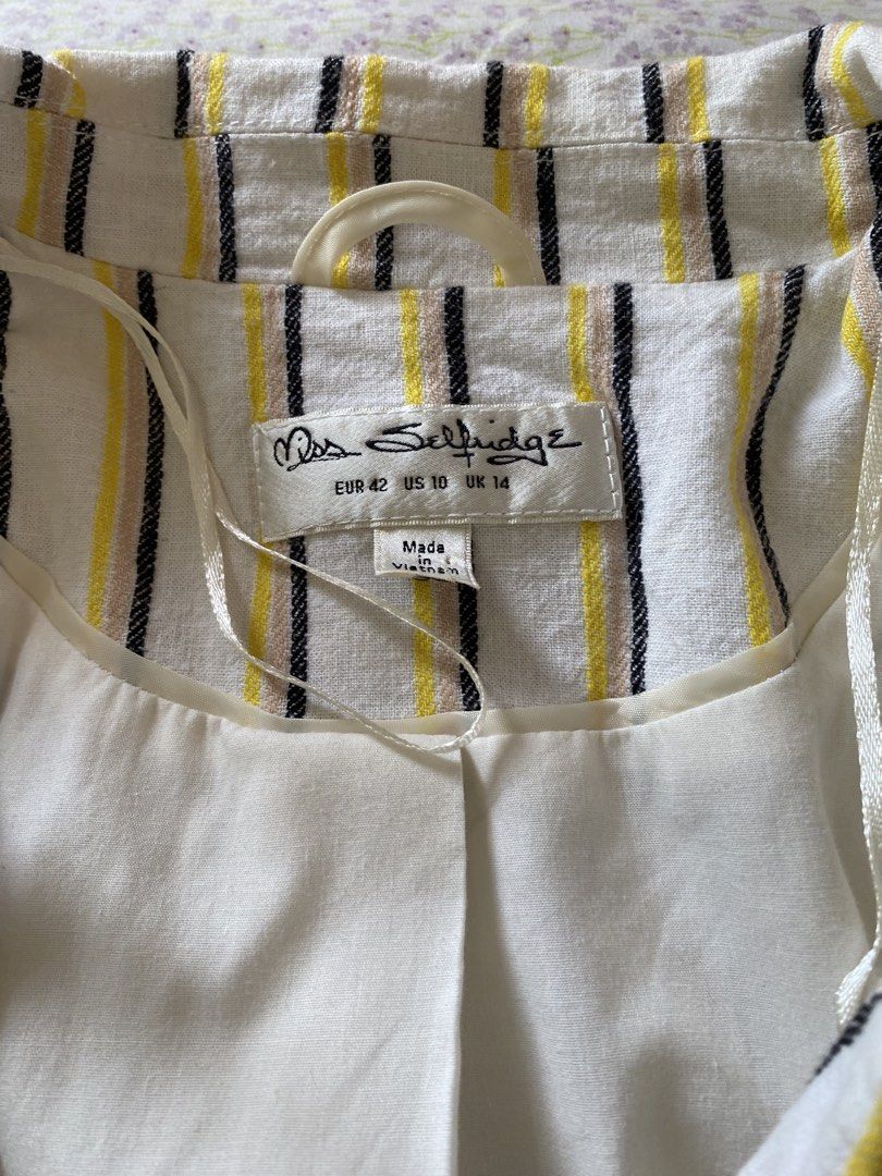 Miss Selfridge Striped Blazer Jacket Size UK 14 (Category: Coats, Jackets and Outerwear) located in Quezon City. Submitted by damclothings.ph (Listing ID 1470953272, Image 2). Description: - Brand: Miss Selfridge - Design: White with yellow, black, and beige vertical stripes - Size: EUR 42, US 10, UK 14 - Details: Fully lined in white, structured shoulders, front pocket flaps - Origin: Made in Vietnam - Style: Great layering piece for smart casua