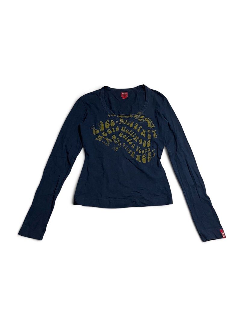 Miss Sixty Navy Long Sleeve Graphic Tee (Category: Longsleeves) located in Manila. Submitted by halukays (Listing ID 1470986613, Image 1). Description: - Brand: Miss Sixty (Made in Italy) - Color: Navy blue with yellow graphic chest print - Design: Gun illustration and "1960 meets miss sixty hollywood golden years western wear" text - Details: Scoop neckline, signature red brand tags on collar and sleeve cuff - Size: Large - Condition: Excellent 