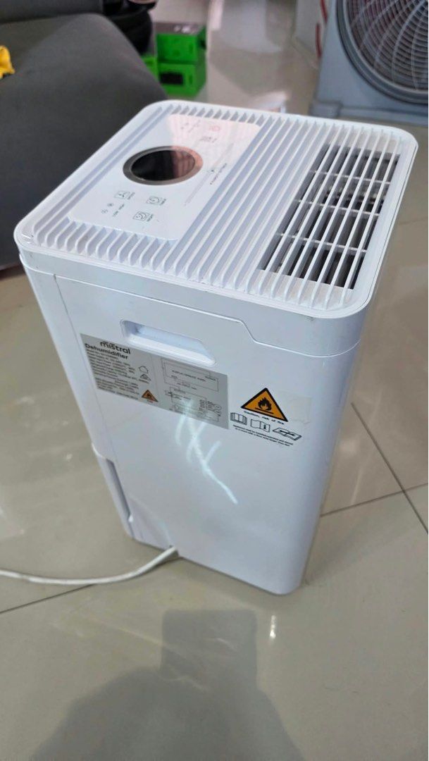 Mistral 12L Dehumidifier White (Category: Air Purifiers & Dehumidifiers) located in Pulilan. Submitted by sebbii (Listing ID 1470964626, Image 2). Description: - Brand: Mistral Dehumidifier (White) - Control Panel: Digital top panel with humidity setting slider, timer, and mode options - Design: Built-in side handle for easy portability - Condition: Clean, working well, includes standard power cord and spec sticker at the back - Benefit: Effectiv
