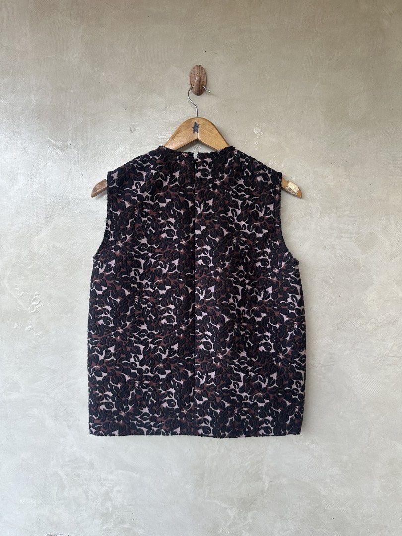 MIU MIU - Multicolour Jacquard Sleeveless Top (Category: Luxury Apparel) located in Cavite. Submitted by second_story_ph (Listing ID 1471066072, Image 2). Description: MIU MIU - Multicolour Jacquard Sleeveless Top A Miu Miu sleeveless jacquard top featuring a purple and black floral pattern, black ruffled front trim, and bright pink side accents. Size: 40 Dimension: 18” Width / 24” Length / 14.5” Shoulder Condition: Like New.