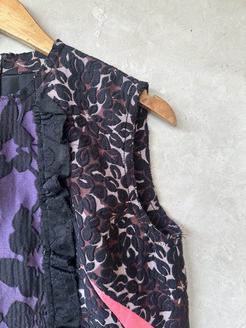 MIU MIU - Multicolour Jacquard Sleeveless Top (Category: Luxury Apparel) located in Cavite. Submitted by second_story_ph (Listing ID 1471066072, Image 3). Description: MIU MIU - Multicolour Jacquard Sleeveless Top A Miu Miu sleeveless jacquard top featuring a purple and black floral pattern, black ruffled front trim, and bright pink side accents. Size: 40 Dimension: 18” Width / 24” Length / 14.5” Shoulder Condition: Like New.