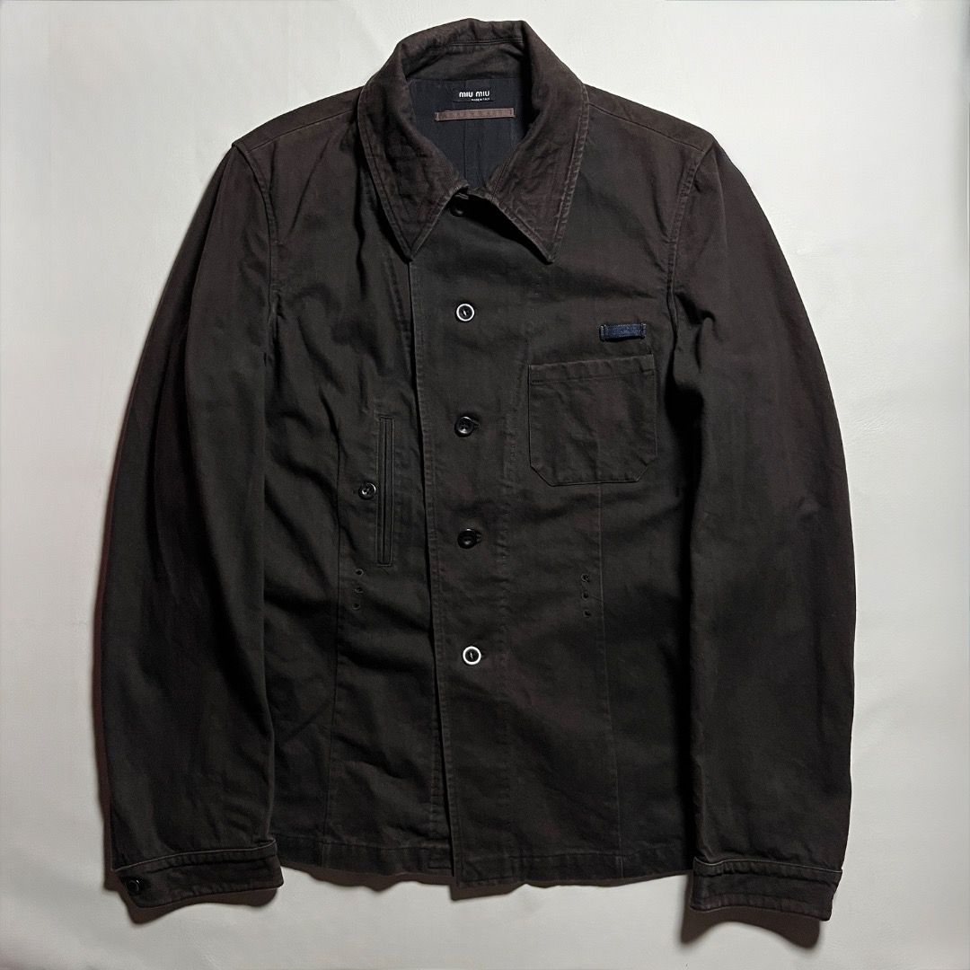 Miu Miu Archive Denim Dark Brown Jacket (Category: Coats, Jackets and Outerwear) located in Caloocan City. Submitted by achilles_grails (Listing ID 1471048158, Image 1). Description: - Brand: Authentic Miu Miu (Made in Italy) - Material: Premium deep brown cotton twill - Design: Contrast topstitching, front button closure, single chest pocket - Fit: Adjustable side tabs at the back waist - Condition: Clean construction, true archive piece.