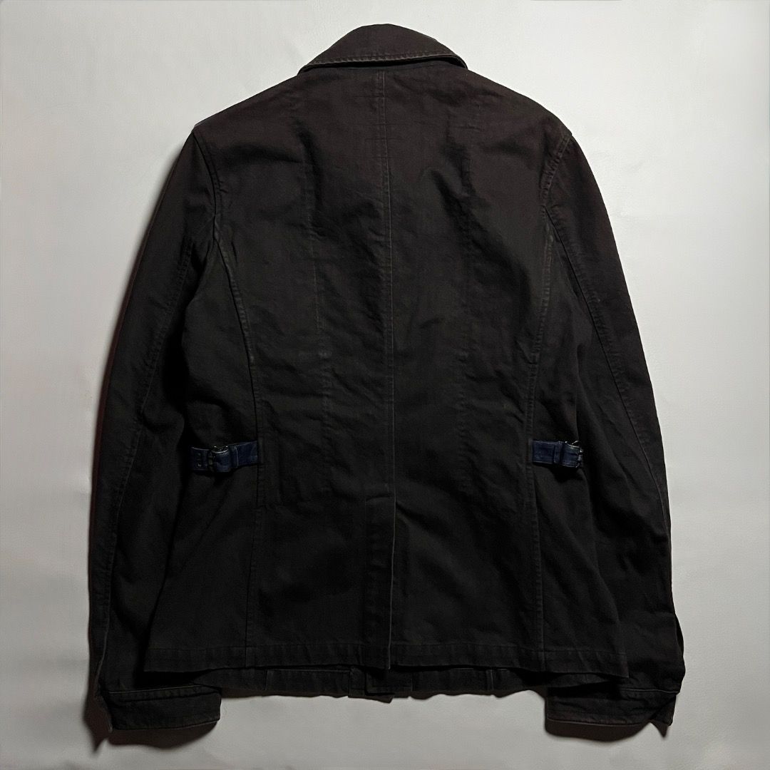 Miu Miu Archive Denim Dark Brown Jacket (Category: Coats, Jackets and Outerwear) located in Caloocan City. Submitted by achilles_grails (Listing ID 1471048158, Image 2). Description: - Brand: Authentic Miu Miu (Made in Italy) - Material: Premium deep brown cotton twill - Design: Contrast topstitching, front button closure, single chest pocket - Fit: Adjustable side tabs at the back waist - Condition: Clean construction, true archive piece.