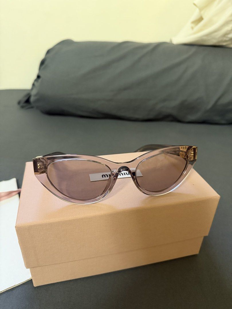 Authentic Miu Miu MM-36 Cat-Eye Sunglasses (Category: Sunglasses & Eyewear) located in Cavite. Submitted by trueluxury_boutique (Listing ID 1470950591, Image 1). Description: Miu Miu MU A04S Butterfly Sunglasses – Transparent Mauve | With Box & Pouch Price: ₱11,500 (Negotiable) Selling my pre-loved Miu Miu MU A04S sunglasses in Transparent Mauve with Light Purple Brown lenses. A beautiful, feminine butterfly-shaped design featuring a translucent 