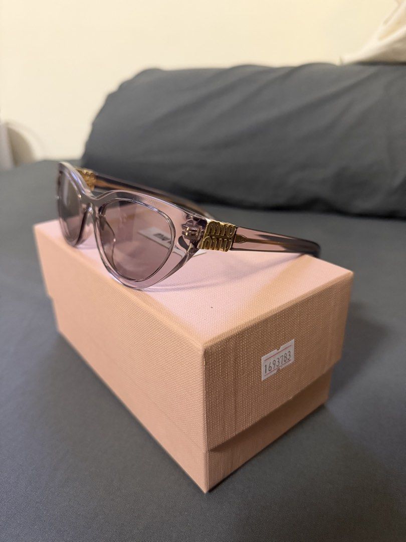 Authentic Miu Miu MM-36 Cat-Eye Sunglasses (Category: Sunglasses & Eyewear) located in Cavite. Submitted by trueluxury_boutique (Listing ID 1470950591, Image 3). Description: Miu Miu MU A04S Butterfly Sunglasses – Transparent Mauve | With Box & Pouch Price: ₱11,500 (Negotiable) Selling my pre-loved Miu Miu MU A04S sunglasses in Transparent Mauve with Light Purple Brown lenses. A beautiful, feminine butterfly-shaped design featuring a translucent 