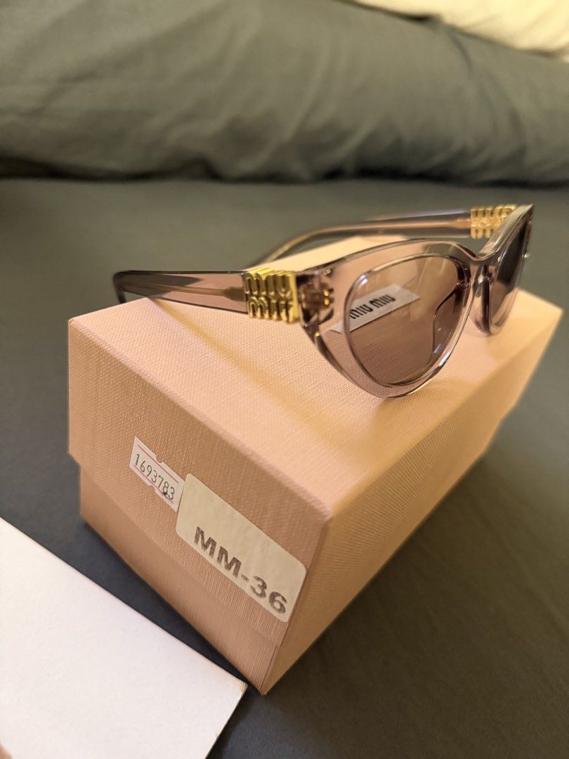 Authentic Miu Miu MM-36 Cat-Eye Sunglasses (Category: Sunglasses & Eyewear) located in Cavite. Submitted by trueluxury_boutique (Listing ID 1470950591, Image 2). Description: Miu Miu MU A04S Butterfly Sunglasses – Transparent Mauve | With Box & Pouch Price: ₱11,500 (Negotiable) Selling my pre-loved Miu Miu MU A04S sunglasses in Transparent Mauve with Light Purple Brown lenses. A beautiful, feminine butterfly-shaped design featuring a translucent 
