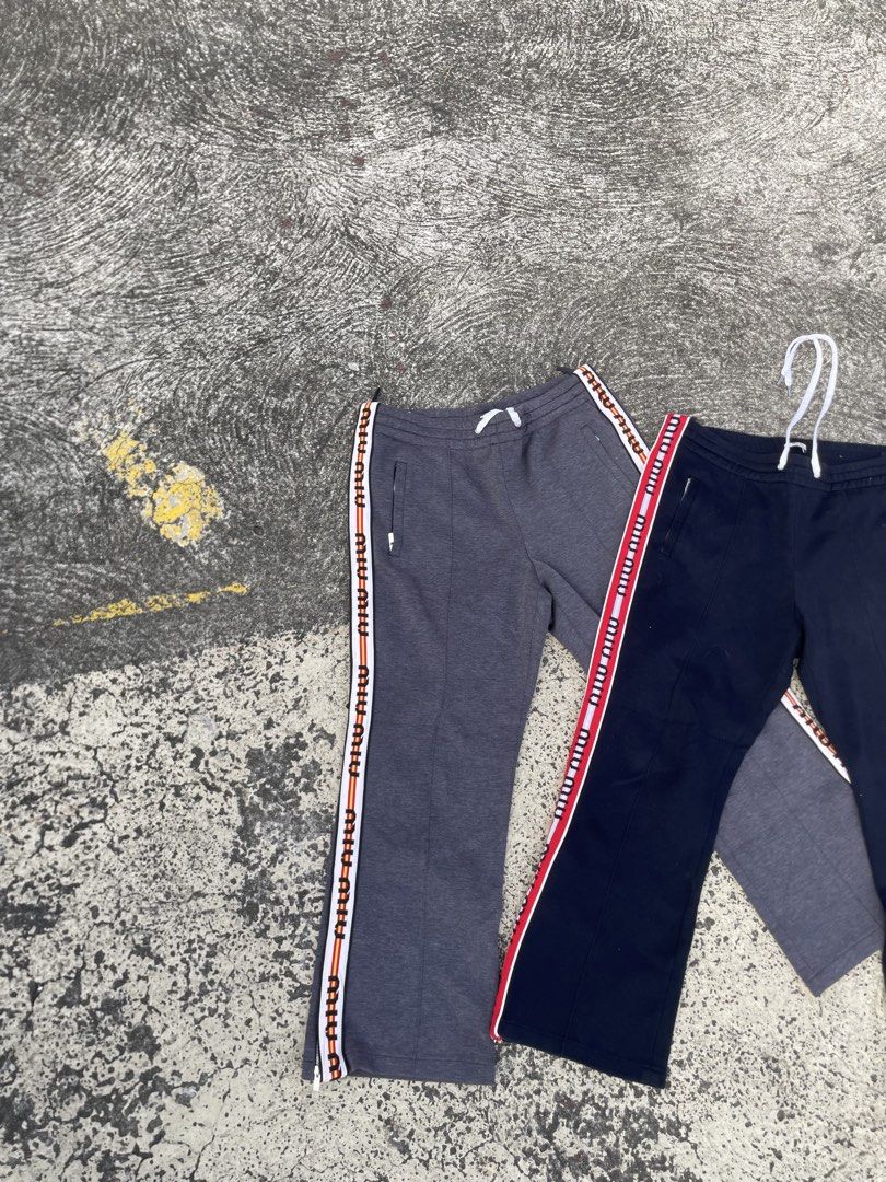 Miu miu striped logo lounge pants(authentic) (Category: Luxury Apparel) located in Alegria. Submitted by deniseeee.21 (Listing ID 1470939395, Image 3). Description: size 44 both womens like new condition Authenticity Guaranteed 100% authentic and fully inspected. Photos show the exact item you will receive 12k bundle.