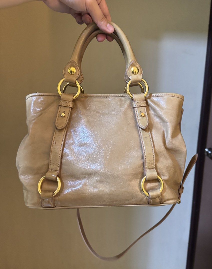 Miu Miu Vitello Two-Way Satchel Bag (Category: Luxury Bags & Wallets) located in Mandaluyong City. Submitted by yumbougieee (Listing ID 1471063533, Image 3). Description: Rank A condition. Pre owned Lightly used, no major flaws Authentic. With Orig dust bag No leather cracks 16k Helping a friend.