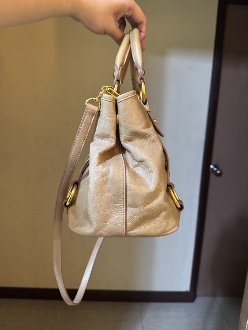 Miu Miu Vitello Two-Way Satchel Bag (Category: Luxury Bags & Wallets) located in Mandaluyong City. Submitted by yumbougieee (Listing ID 1471063533, Image 2). Description: Rank A condition. Pre owned Lightly used, no major flaws Authentic. With Orig dust bag No leather cracks 16k Helping a friend.