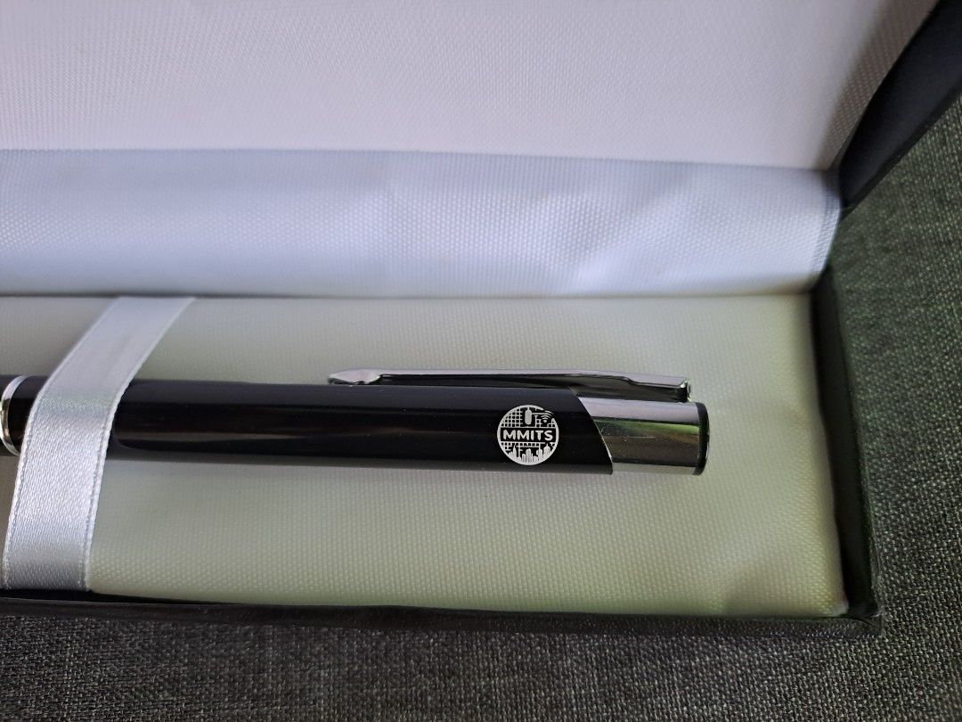 Promotional Pen in Gift Box (Category: Stationery & School Supplies) located in Quezon City. Submitted by ph_araoh (Listing ID 1470991657, Image 3). Description: - Item: Brand new black click pen with MMITS logo - Sleek black body with stylish silver-tone clip and tip - Packaging: Includes black box - Condition: 100% unused and clean - Ideal For: Gifting, office use, or memorabilia collection Courier delivery available P95 shipping within Metro M