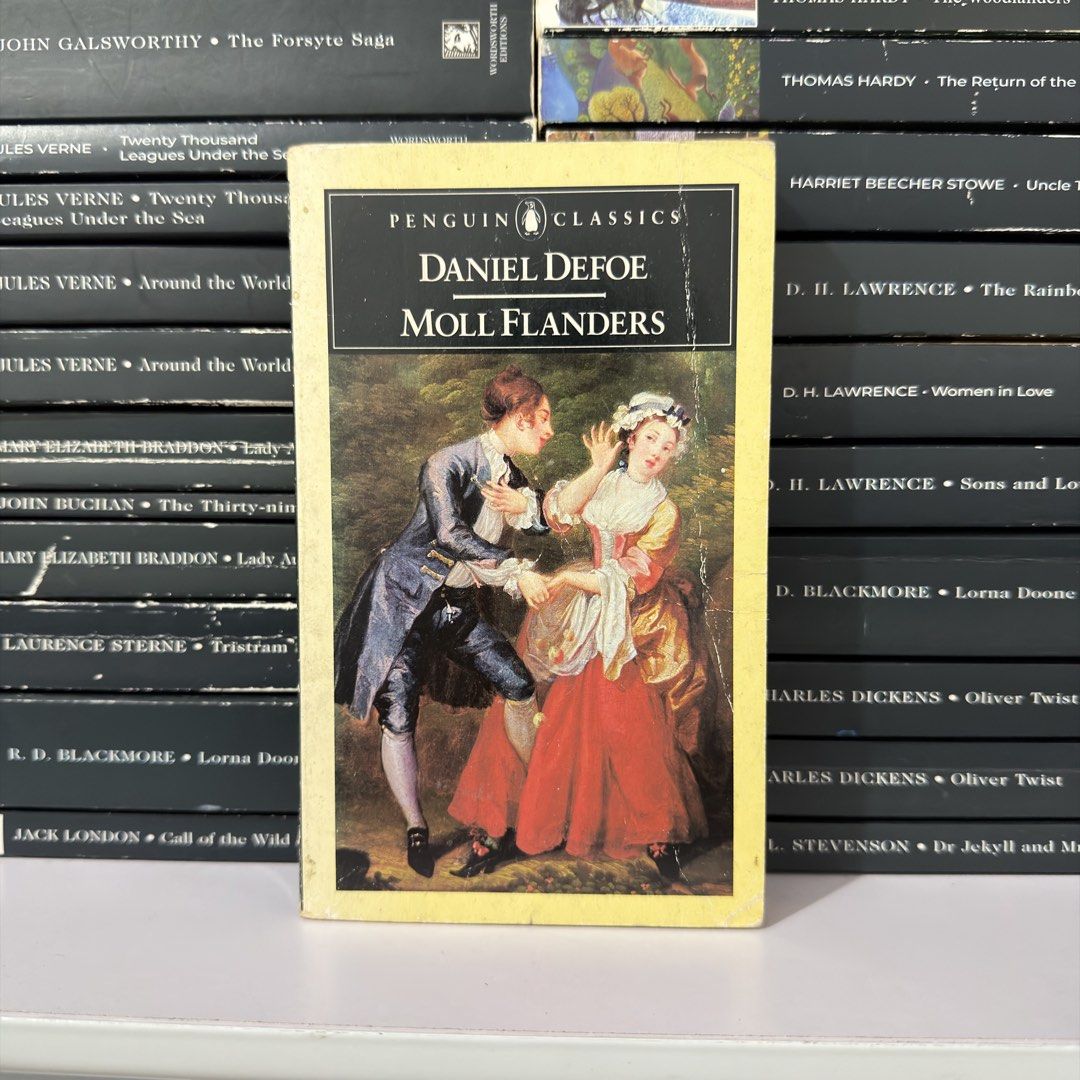 Moll Flanders by Daniel Defoe Penguin Classics Paperback (Category: Storybooks) located in Lingayen. Submitted by readwjane (Listing ID 1471091518, Image 1). Description: - Title: Moll Flanders by Daniel Defoe - Edition: Penguin Classics Paperback - Cover Art: Classic yellow border design featuring an 18th-century couple - Condition: Good, well-maintained - Perfect for: Classic literature collectors and book lovers.