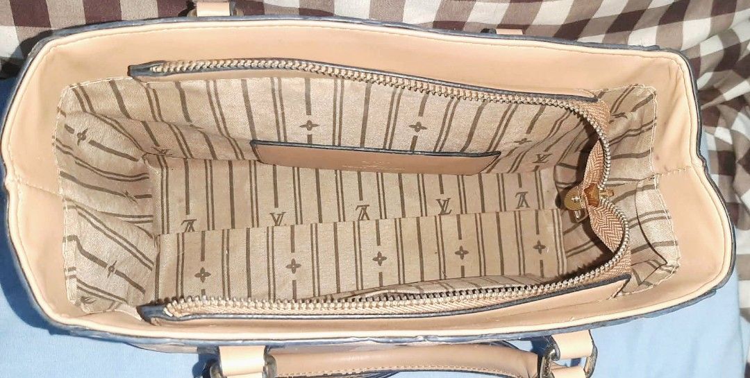 Monogram Tote Hand/Sling Bag (Beige) (Category: Cross-body Bags) located in Las Pinas. Submitted by anna_katrina (Listing ID 1471035833, Image 3). Description: -Material: Embossed leather in a versatile beige shade - Design: Structured shape with dual top handles - Closure & Storage: Secure zip compartment inside - Strap: Includes a long detachable shoulder strap with gold-tone hardware - Interior: Chic striped fabric lining complete with a signa