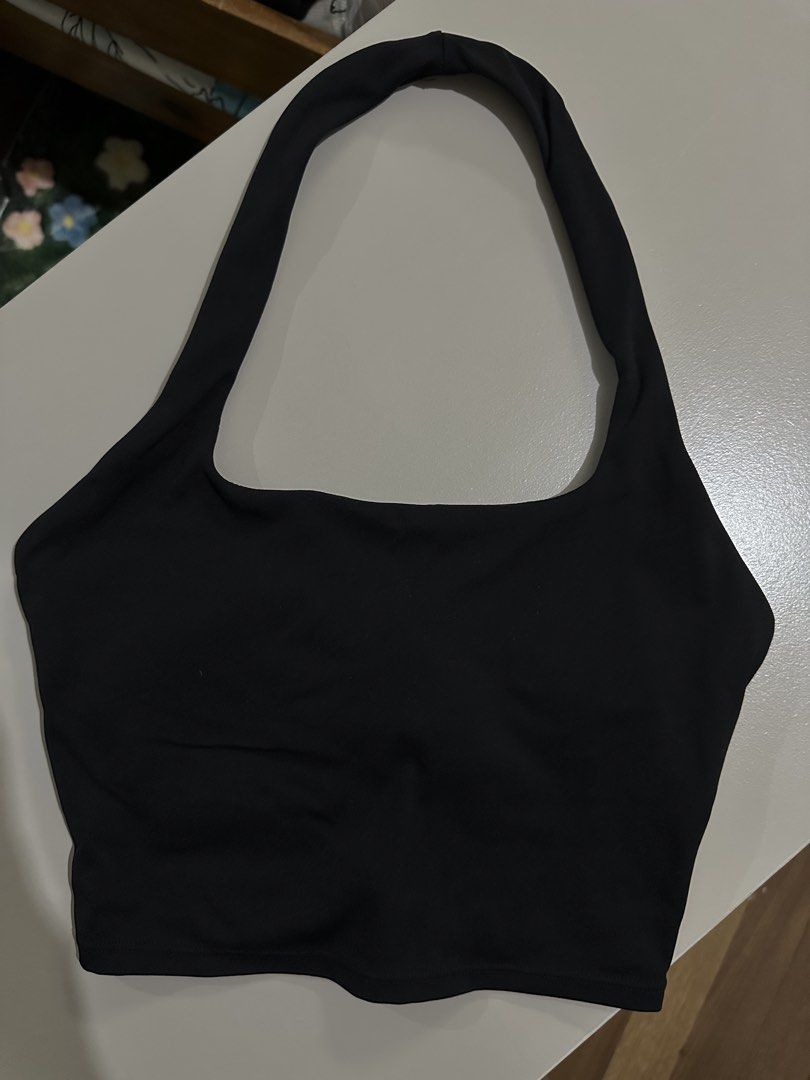 Moving Peach Black Halter Crop Top Size S (Category: Sleeveless) located in Antipolo. Submitted by wxyz9876 (Listing ID 1470961561, Image 2). Description: - Brand/Model: Moving Peach black halter crop top - Size: S - Design: Chic square neckline with a stylish ruched back detail - Support: Includes removable pads for customizable comfort - Material: Breathable activewear fabric, ideal for workouts and casual wear - Care: Machine washable up to 30