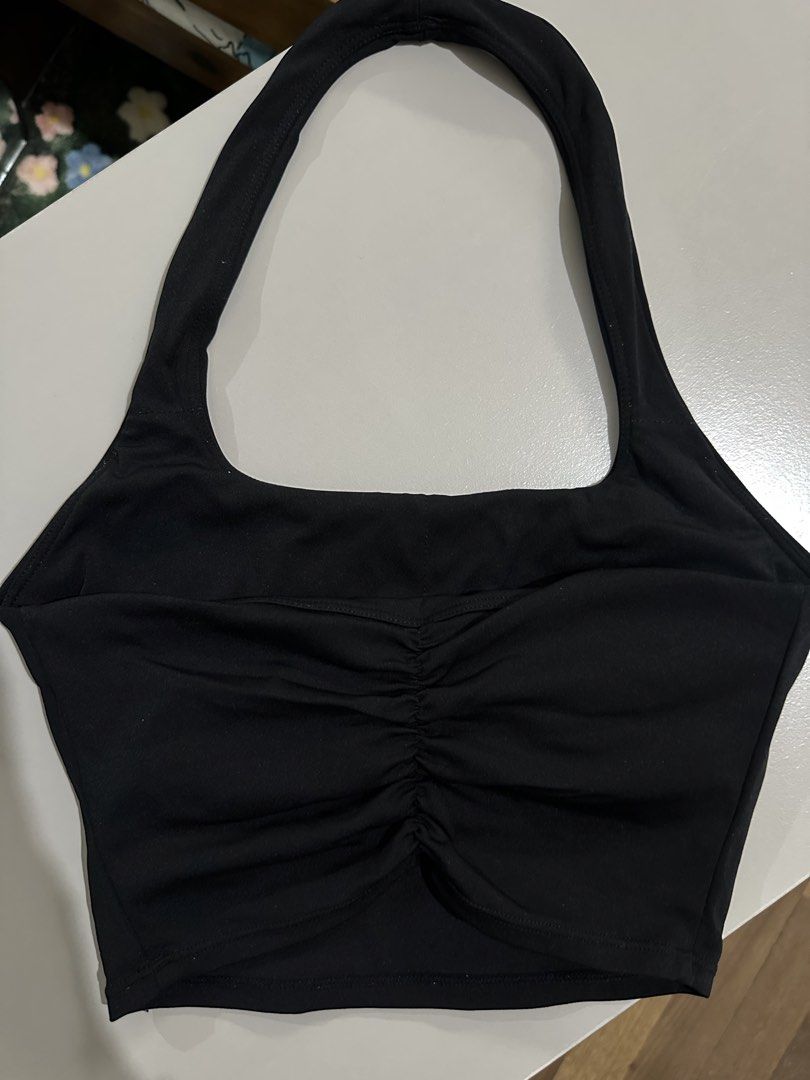 Moving Peach Black Halter Crop Top Size S (Category: Sleeveless) located in Antipolo. Submitted by wxyz9876 (Listing ID 1470961561, Image 3). Description: - Brand/Model: Moving Peach black halter crop top - Size: S - Design: Chic square neckline with a stylish ruched back detail - Support: Includes removable pads for customizable comfort - Material: Breathable activewear fabric, ideal for workouts and casual wear - Care: Machine washable up to 30