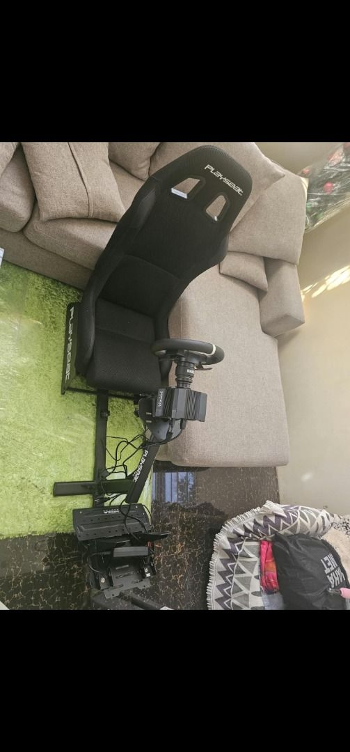 Moza Racing Simulator Rig with Playseat Cockpit (Category: Controllers) located in Muntinlupa City. Submitted by wsgb1227 (Listing ID 1471081550, Image 1). Description: - Complete ready-to-race sim setup - Moza Racing direct drive wheel base and steering wheel - Sturdy Playseat cockpit with integrated pedal deck - Comfortable racing bucket seat included - Fully wired for PC and console plug-and-play - Selling due to upgrade.
