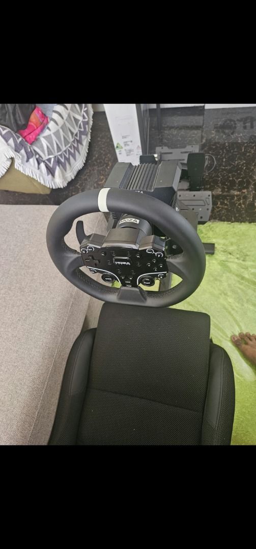 Moza Racing Simulator Rig with Playseat Cockpit (Category: Controllers) located in Muntinlupa City. Submitted by wsgb1227 (Listing ID 1471081550, Image 2). Description: - Complete ready-to-race sim setup - Moza Racing direct drive wheel base and steering wheel - Sturdy Playseat cockpit with integrated pedal deck - Comfortable racing bucket seat included - Fully wired for PC and console plug-and-play - Selling due to upgrade.