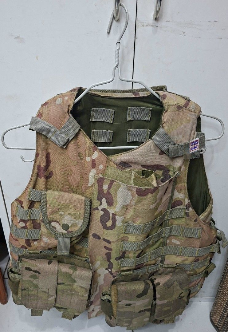 Multicam Tactical Vest with Pockets (Category: Vests) located in Manila. Submitted by glydelmalu86312 (Listing ID 1470988231, Image 2). Description: Tactical vest in multicam camouflage pattern. Multiple built-in pouches for gear and mags. Adjustable shoulder straps with hook-and-loop panels. Olive green inner lining. Sturdy hardware and snap buttons on pouches. Great for airsoft, paintball, or outdoor activities. Solid stitching all around..